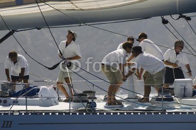 biker3, Side view of crew members working on sailboat (40s, 30s, 20s, 50s, erwachsen, seil, gespann, jung, teamwork, working, segelboot, abenteuer, yacht, wassersport, crew, matrosen, wasserfahrzeuge, gruppe, leute, person, mann, mann, stehendes, seitenansicht, nautisch, boot, bootfahren, verkehr, schiff)