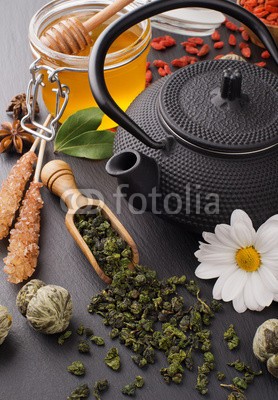 andriigorulko, still life with green tea and honey over black stone (tee, grün, teekanne, stilleben, schwarz, eisen, leaf, blume, essen, trinken, honig, sätze, braun, sugar, schlenge, schöpflöffel, krug, anis, stern, gesundheit, diä)