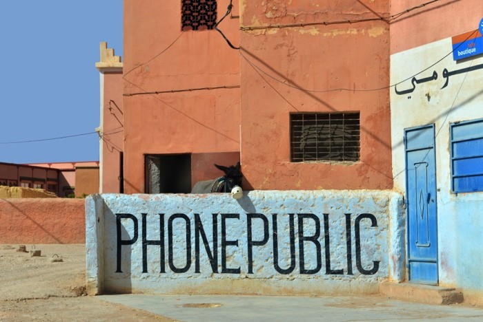 Hady Khandani, PHONEPUBLIC DONKEY - MOROCCO (HADYPHOTO, Fotografie, Gebäude, öffentliches Telefon, Esel, witzig, Terppenhaus, Wunschgröße, bunt)
