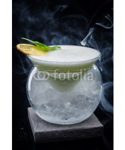 fotoatelie, Exotic alcoholic cocktail on a dark background.