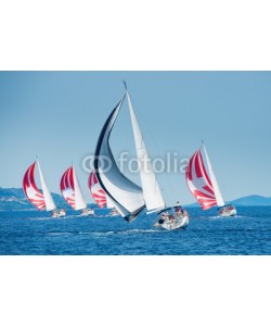 Pavel, Sailing boat with black and white spinnaker catching up sailing boat on horizon