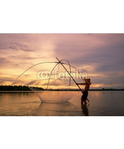 sutiporn, Fisherman on silhouette sunrise with gear fishing on the lake is a culture of Thai or Laos people's