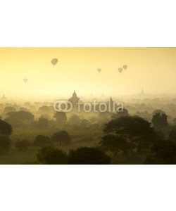 Sakrapee Nopparat, Hot air balloons fly over the pagoda ancient city field on silhouette sunrise scene at Bagan Myanmar.