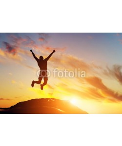 Photocreo Bednarek, Happy man jumping for joy on the peak of the mountain. Success