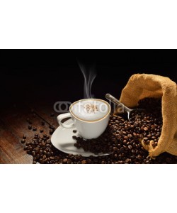 amenic181, Cup of coffee with smoke and coffee beans on old wooden table