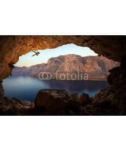Andrey Bandurenko, Male rock climber on a cliff in a cave at Kalymnos, Greece
