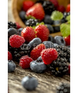 Gajus, Raspberries, strawberries, blackberries and blueberries scatteri