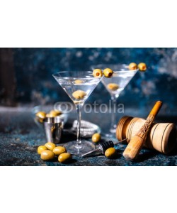 Hoda Bogdan, Martini cocktail drink with olives garnish and tools on rusty background