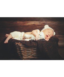 JenkoAtaman, Cute newborn baby in bear hat sleeps in basket with toy teddy be