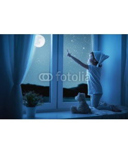JenkoAtaman, child little girl at window dreaming and admiring starry sky at