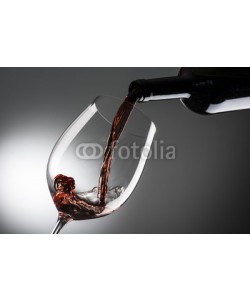 MAURO, glass with red wine on dark background