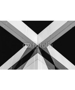 taurusnyy, Abstract image of building facade. Architecture detail on exterior building wall. Light and shadow on building wall. Architectural detail and design. Black and white and abstract colors.