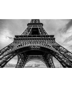 GooDAura, Black-white photo of close-up element part of Eiffel tower in Paris against dramatic twilight sky at evening summer time.