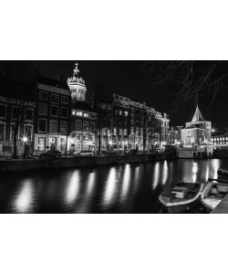 GooDAura, AMSTERDAM, NETHERLANDS - DECEMBER 14, 2015: Black-white photo of general view night canals in Amsterdam, Netherlands.