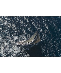 biker3, Top view of a sailboat in the blue ocean