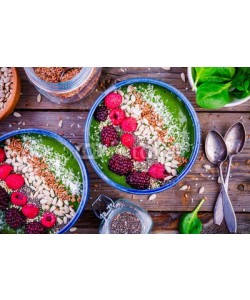 nblxer, Green spinach smoothie bowl with raspberry,.blackberry,.flax seeds, sunflower seeds and coconut chips