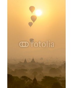 Sakrapee Nopparat, Hot air balloons fly over the pagoda ancient city field on silhouette sunrise scene at Bagan Myanmar.