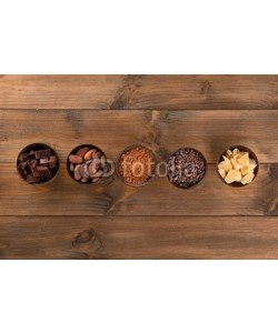 Africa Studio, Bowls with cocoa products on wooden background