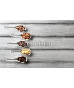 Africa Studio, Spoons with different cocoa products on wooden background