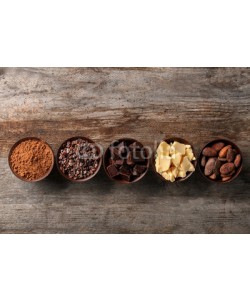 Africa Studio, Bowls with cocoa products on wooden background