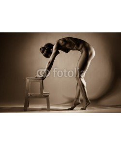 Anton Belovodchenko, Naked woman body on black background. Fine art photo of woman body.