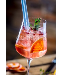 weyo, Cocktail drink on a old  wooden board. Alcoholic beverage with tropical fruits red pepper herb and ice