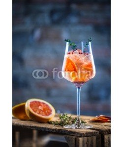 weyo, Cocktail drink on a old  wooden board. Alcoholic beverage with tropical fruits red pepper herb and ice