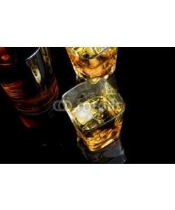 donfiore, top of view of whiskey with ice in glass on black background
