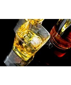 donfiore, top of view of whiskey with ice in glass on black background
