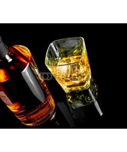 donfiore, top of view of whiskey with ice in glass on black background