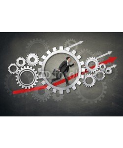 Coloures-pic, Mann im Zahnrad  mit Pfeilen nach oben