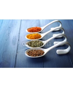 Africa Studio, Different kinds of spices in ceramics spoons, close-up,