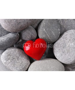 Africa Studio, Red heard over pebbles background