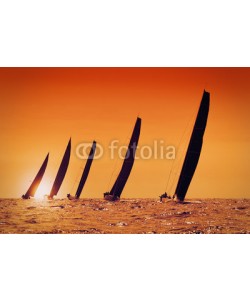 Federico Rostagno, sailing yachts at sunset on the sea