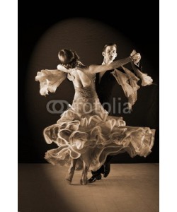 air, Latino dancers in ballroom against black background