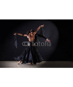 air, Latino dancers in ballroom against on black background