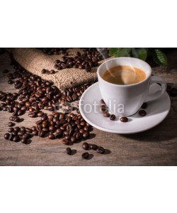 Alexander Raths, Cup of coffee and coffee beans on wooden background