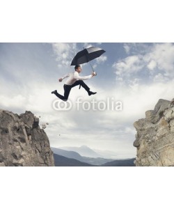 alphaspirit, Businessman jumping over the mountains