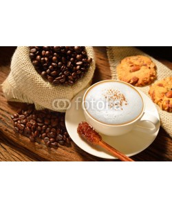 amenic181, A cup of cappuccino with coffee beans and cookies