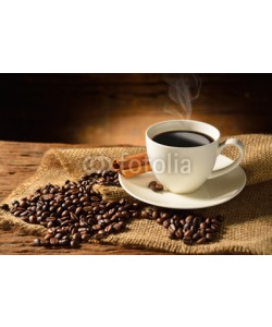 amenic181, Coffee cup and coffee beans on old wooden background