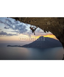 Andrey Bandurenko, Male rock climber at sunset. Kalymnos Island, Greece