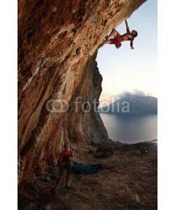 Andrey Bandurenko, Rock climber at sunset. Kalymnos Island, Greece.