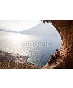 Andrey Bandurenko, Young couple of rock climbers having a rest, Kalymnos, Greece