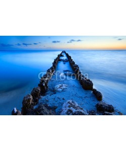 catolla, old breakwater in North sea in dusk