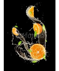 Jag_cz, Oranges in water splash, isolated on black background
