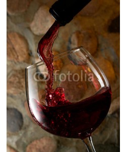 misaleva, Red wine pouring on stone wall