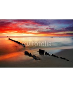 TTstudio, Poland, Ocean sunset on beach.