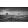 MaciejBledowski, Black and white photo of Monument Valley with car lights trails at night, USA.